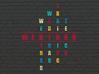 Image showing Education concept: word Webinar in solving Crossword Puzzle