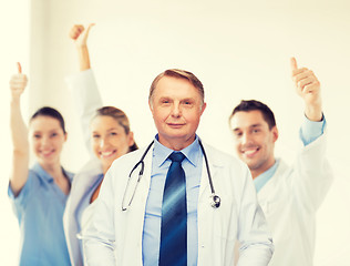 Image showing smiling doctor or professor with stethoscope