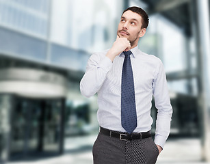 Image showing handsome businessman looking up