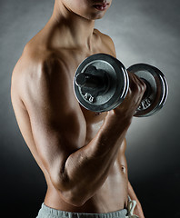 Image showing young man with dumbbell