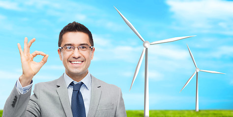 Image showing happy smiling businessman in eyeglasses and suit