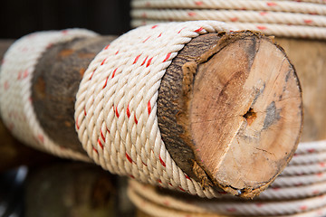 Image showing wooden beam wrapped with rope