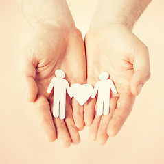 Image showing man hands with paper men