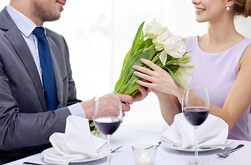 Image showing young couple with glasses of wine at restaurant