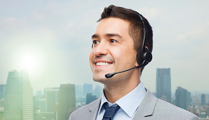 Image showing smiling businessman in headset