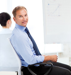 Image showing businessman on business meeting in office