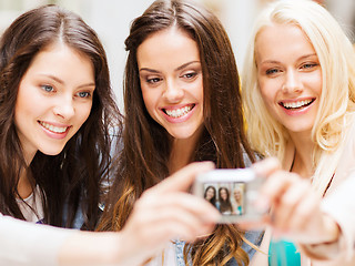 Image showing beautiful girls taking picture in cafe in city