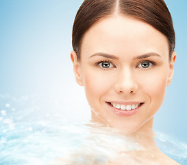 Image showing face of beautiful young woman and water splash