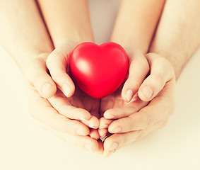 Image showing woman and man hands with heart