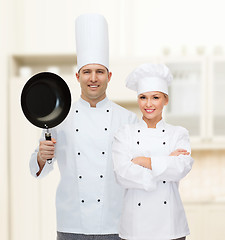 Image showing happy male chef cook holding frying pan