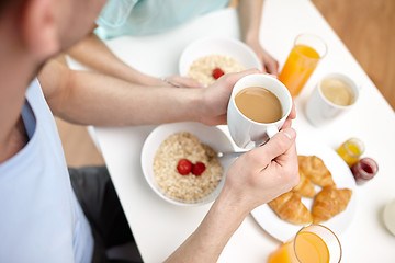 Image showing close up of couple having breakfast at home