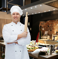 Image showing happy male chef cook holding rolling pin