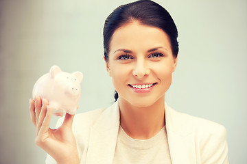 Image showing lovely woman with piggy bank