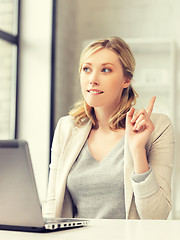 Image showing woman with laptop and finger up