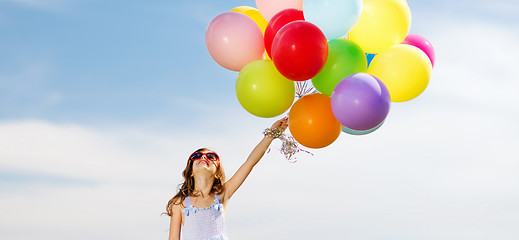 Image showing happy girl with colorful balloons