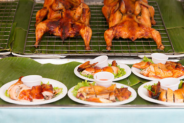 Image showing grilled or fried chicken on plate at street market