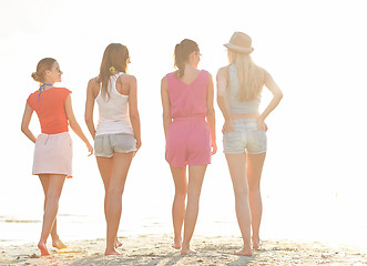 Image showing group of young women walking on beach