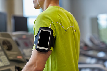 Image showing close up of man exercising on treadmill in gym