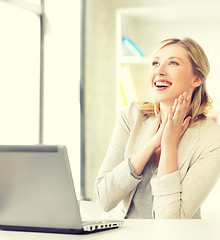 Image showing happy woman with laptop computer