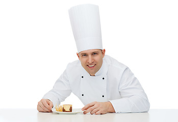 Image showing happy male chef cook with dessert