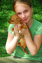 Image showing Girl with a dog