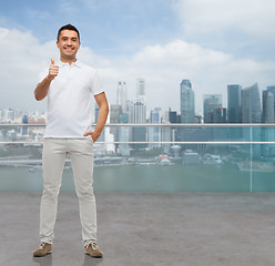 Image showing smiling man showing thumbs up