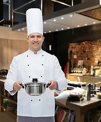 Image showing happy male chef cook holding pot