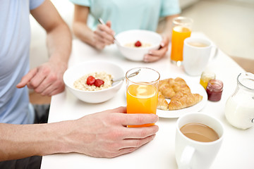 Image showing close up of couple having breakfast at home