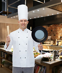 Image showing happy male chef holding frying pan and spatula