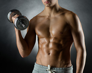 Image showing young man with dumbbell