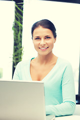 Image showing happy woman with laptop computer