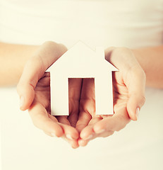 Image showing woman hands holding paper house