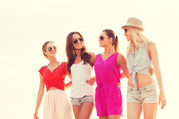 Image showing group of smiling women in sunglasses on beach