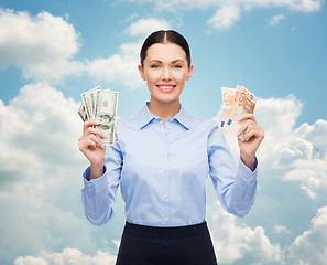 Image showing businesswoman with dollar cash money