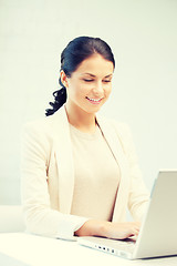 Image showing happy woman with laptop computer