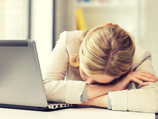 Image showing tired woman with laptop computer