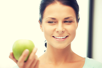 Image showing lovely housewife with green apple