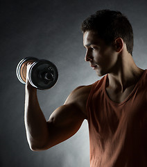 Image showing young man with dumbbell