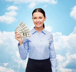 Image showing businesswoman with dollar cash money