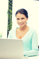 Image showing happy woman with laptop computer