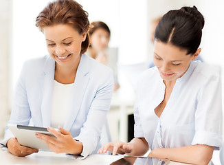 Image showing business team working with tablet pc in office