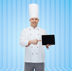 Image showing happy male chef cook showing tablet pc