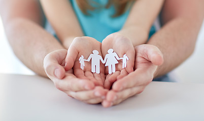 Image showing close up of man and girl with cupped hands at home