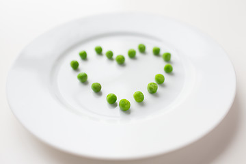 Image showing close up of plate with peas in heart shape 