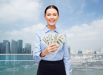 Image showing businesswoman with dollar cash money