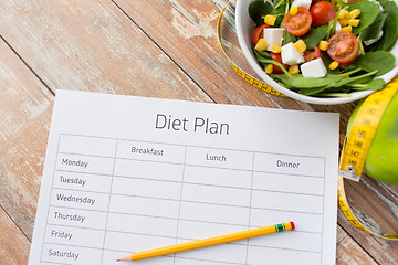 Image showing close up of diet plan and food on table