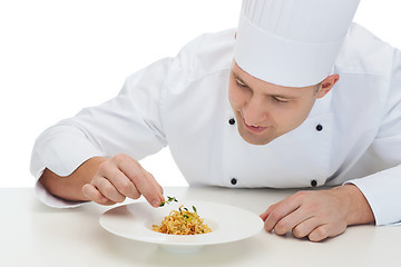 Image showing happy male chef cook decorating dish