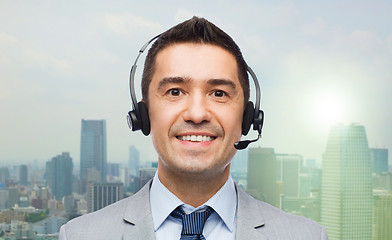 Image showing smiling businessman in headset