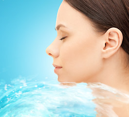 Image showing face of beautiful young woman and water splash