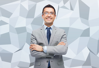 Image showing happy smiling businessman in eyeglasses and suit